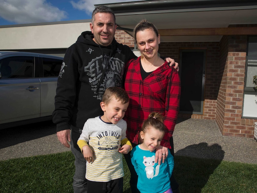 Paul Hili, pictured with his wife Lydia and kids Jake and Tiana at the front of their home
