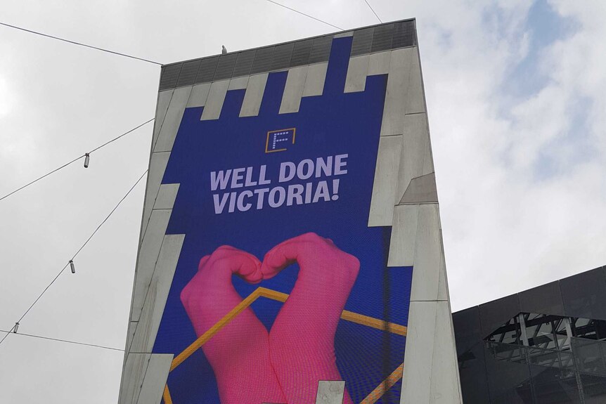 A sign at Federation Square after Melburnians came out of lockdown in early November says "well done Victoria".