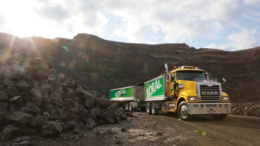 A truck loads material from an active Australian basalt quarry