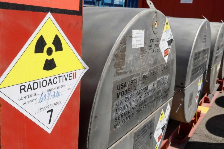 Signage and metal drums containing uranium