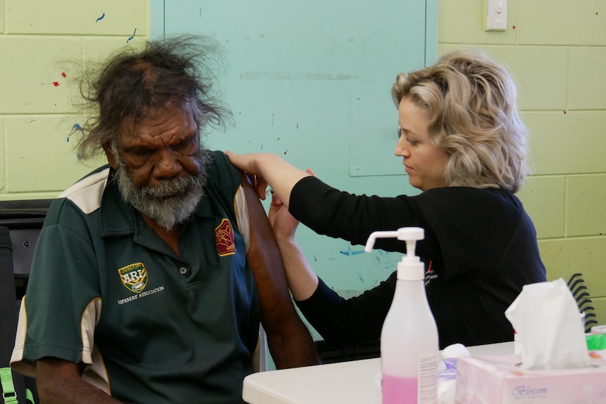 Indigenous man receiving astrazeneca coronavirus vaccine