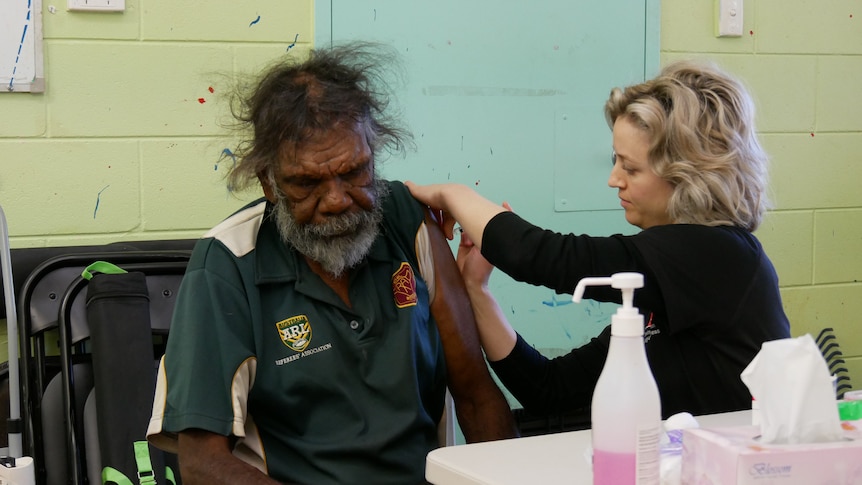 A man receiving astrazeneca coronavirus vaccine