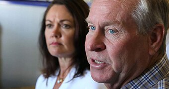 A tight shot of the faces of Colin Barnett and, behind him, Liza Harvey.