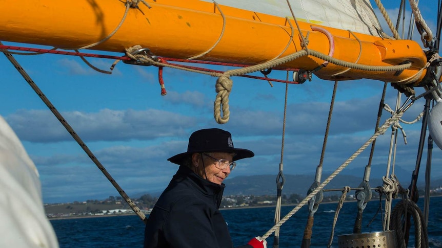 Volunteer Maria Groenewold adjusting the set of the sails on Julie Burgess