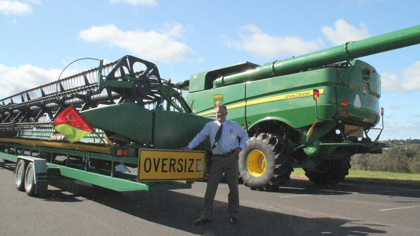 Bob Wythes, chairman of the current Grain Harvesters Association with a harvester.