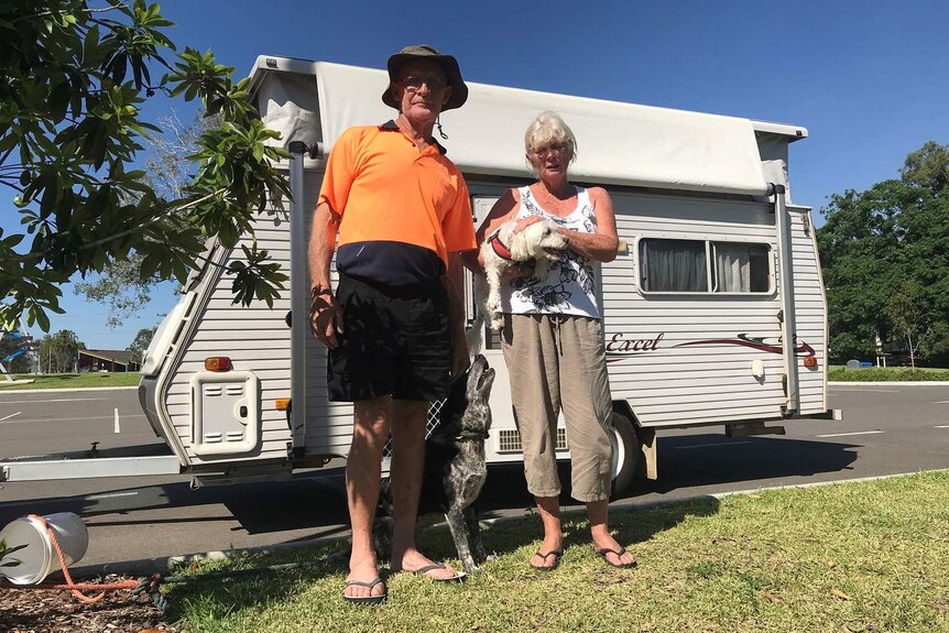 Debra and Bob Wait with their caravan and dogs Sally and Jakes.