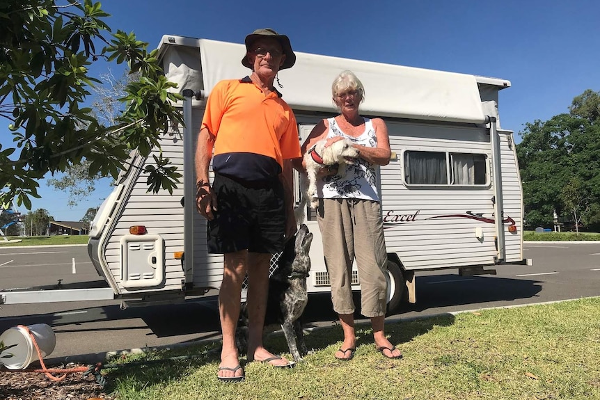 Debra and Bob Wait with their caravan and dogs Sally and Jakes.