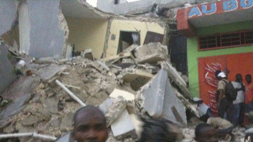 An unverified photo of people in the middle of rubble in Haiti