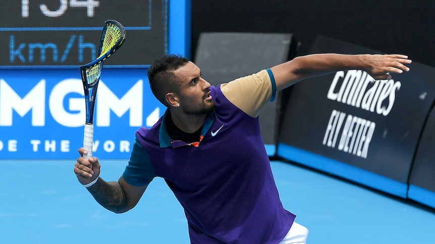 Tennis player Nick Kyrgios winds up to throw his broken racket off the court during a match.