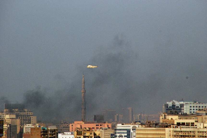 Helicopter flies over burning Cairo