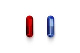 A red pill and a blue pill on a white bench.