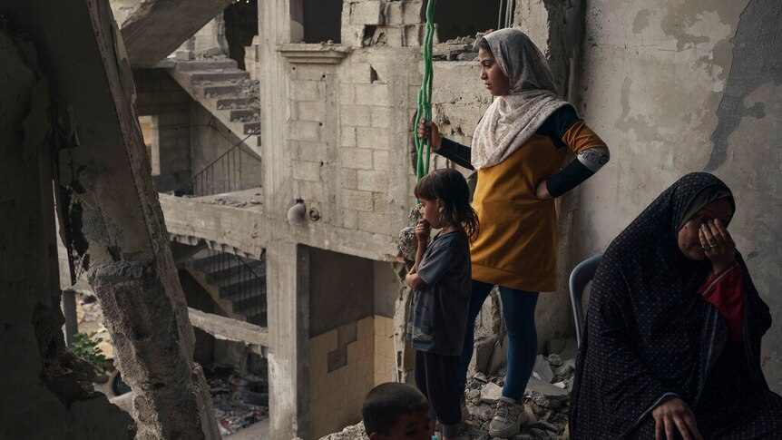 Children in Gaza surveying rubble