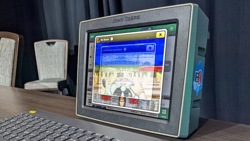a computer from a John Deere tractor with DOOM game
