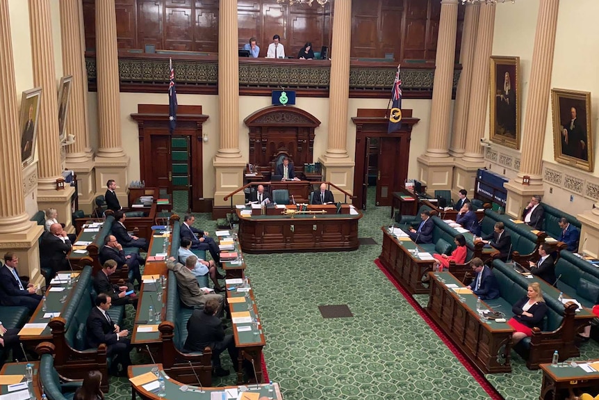 Inside a green parliamentary chamber