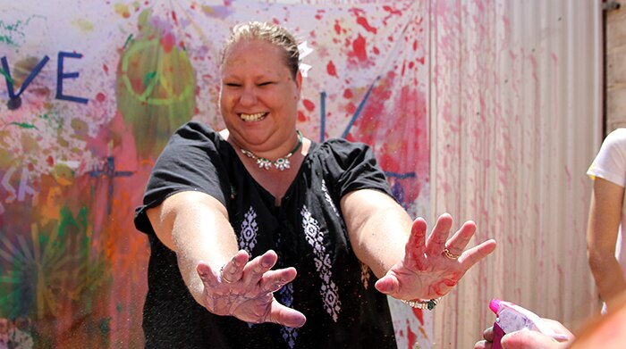 Kellie McKinlay-Hughes gets squirted with paint.