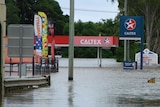 A petrol station at Bourbong Street in Bundaberg is under water.