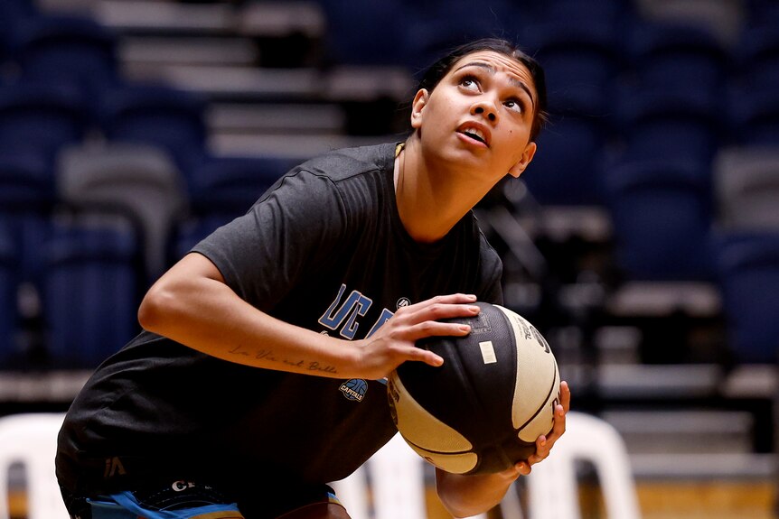 Shaneice Swain of UC Capitals warms up before a WNBL game.