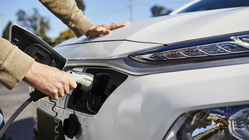 Electric car being charged