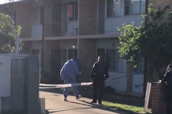 Police outside units in Milton Street in Mackay in north Queensland after a man's body was found