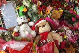 Teddy bears, notes and floral tributes left outside Manoora house