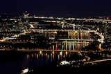 A long time exposure shows a night view of bridges over the Danube river from Leopoldsberg in Vienna,