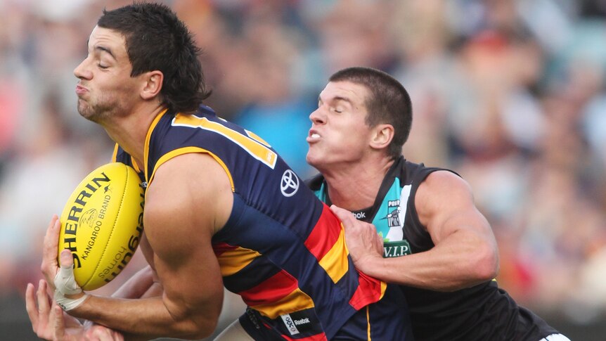 Leading the way: Taylor Walker stood up to kick six for the Crows.