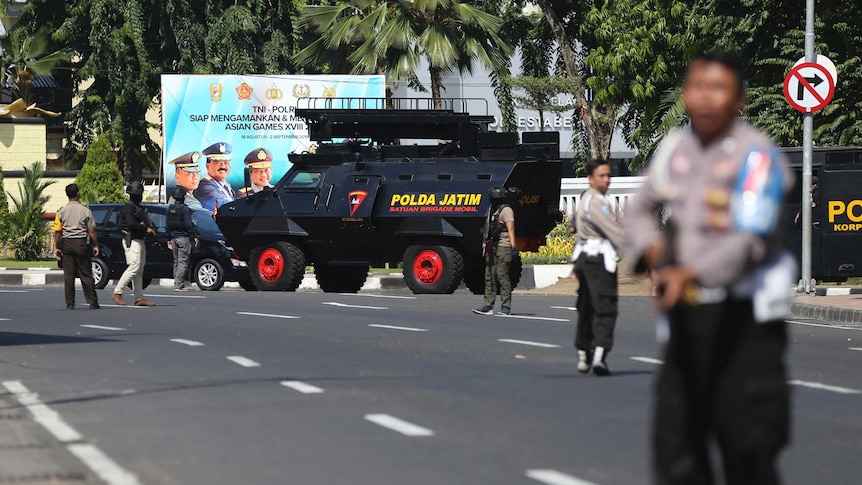 Police block road after suicide bombing in Surabaya