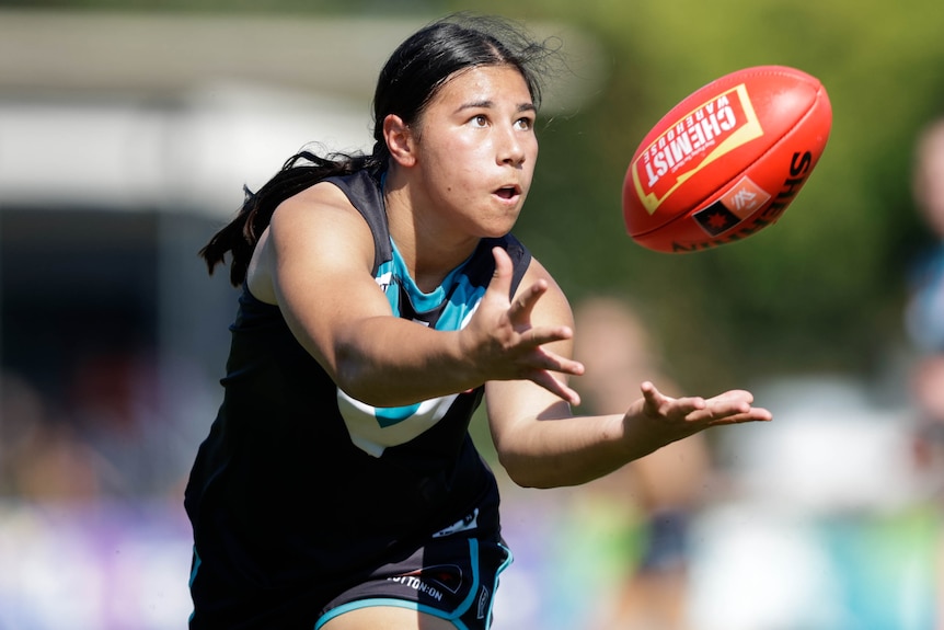 Hannah Ewings of Port Adelaide marks the ball during a game against the Gold Coast Suns