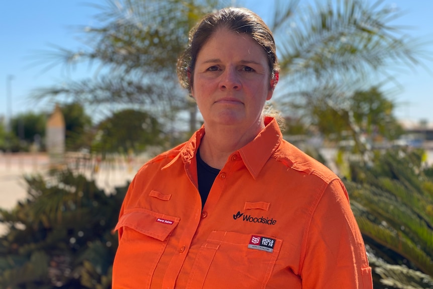 Liz Westcott in an orange Woodside shirt.