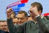 Serbian President Aleksandar Vučić celebrates in his party headquarters