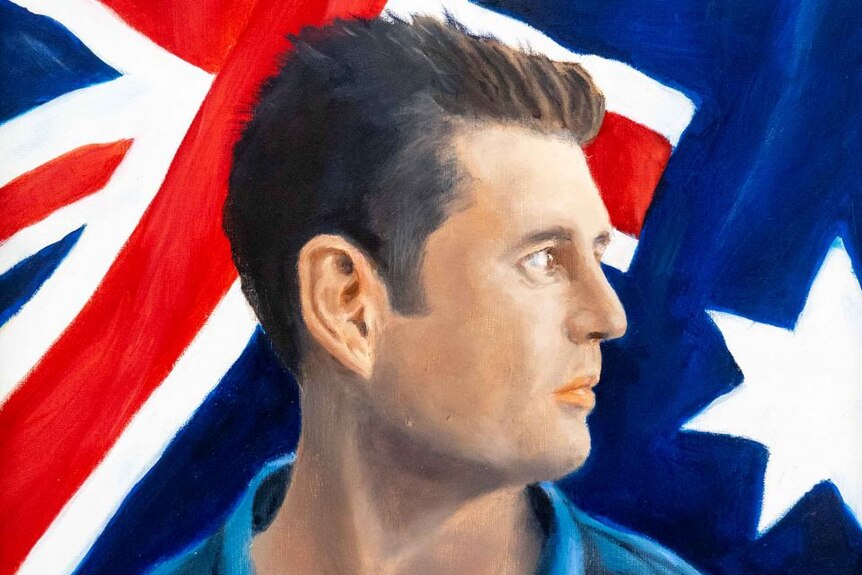 A young man's serious profile is painted in front of the Australian jack flag
