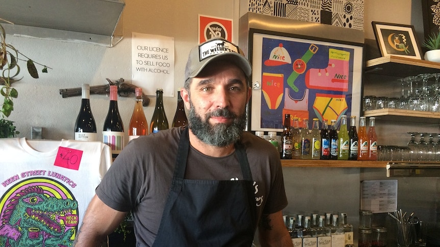 Andrea Bonotto stands behind the bar of Lismore cafe Dirty Wilson.