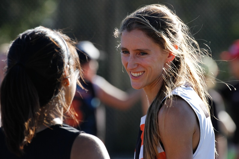 Michelle grins widely while playing ultimate frisbee with her favourite club.