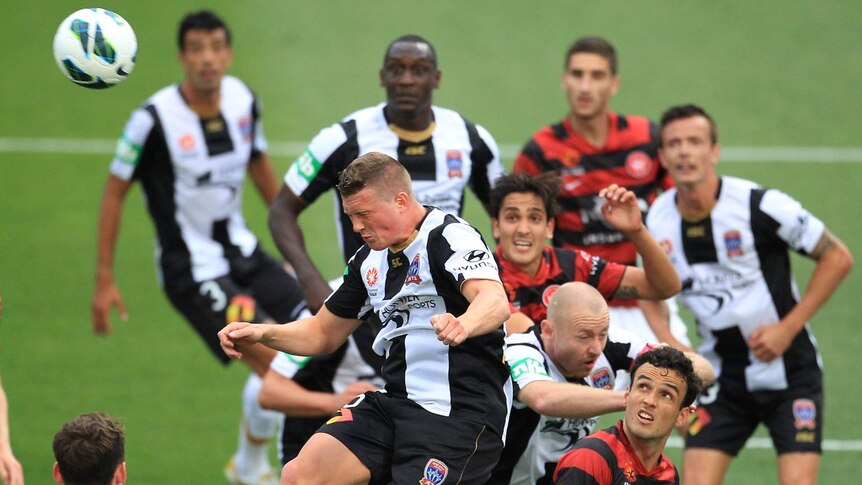 Dominik Ritter makes another clearance for the Jets in their A-League win over the Wanderers.