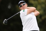 A South African golfer hits a tee shot during the women's Australian Open.