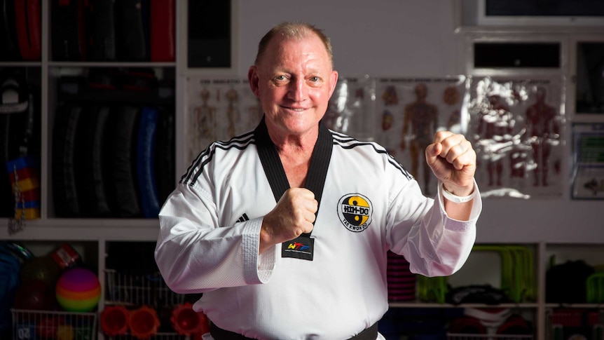 Ronald Bergan stands in a taekwondo pose.