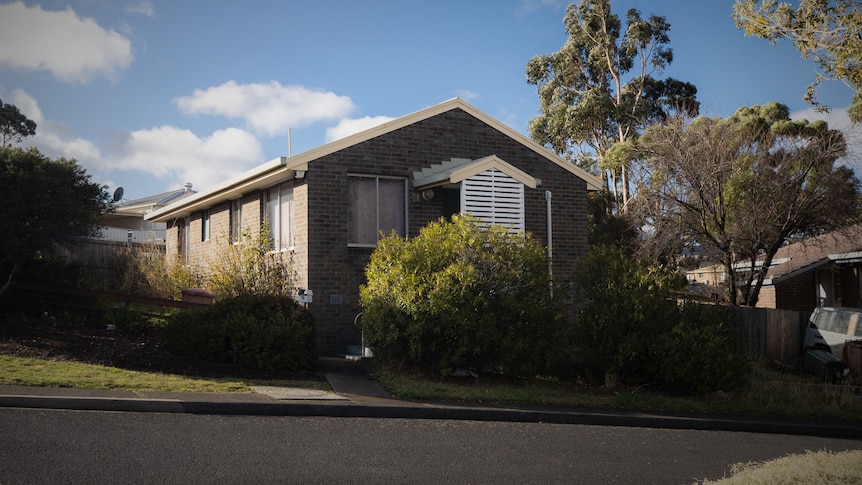 Exterior of house in suburban street.