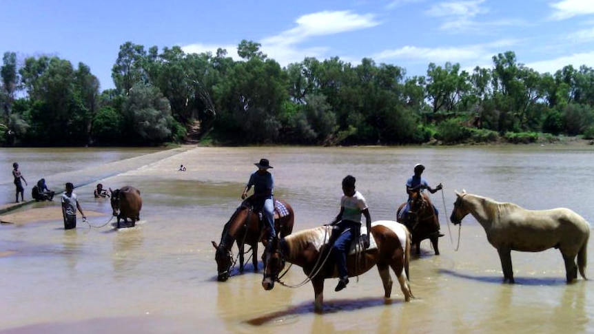 Aboriginal youth on horseback