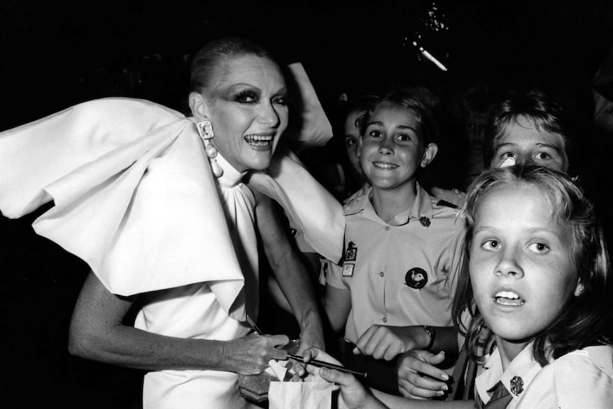 Jeanne signs autographs