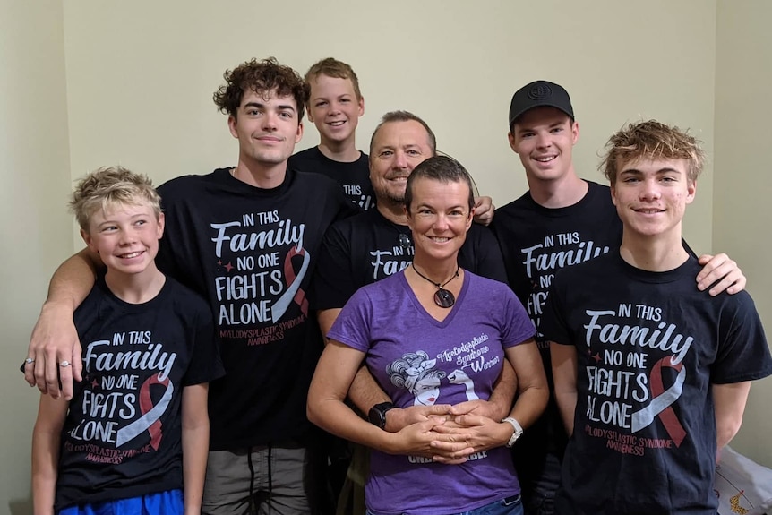 Fiona McWhirter surrounded by her husband and five children.