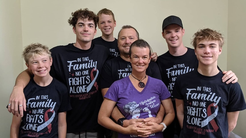 Fiona McWhirter surrounded by her husband and five children.