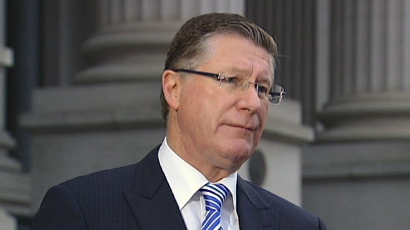 Victorian Premier Denis Napthine on the steps of Parliament.