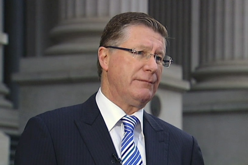 Victorian Premier Denis Napthine on the steps of Parliament.
