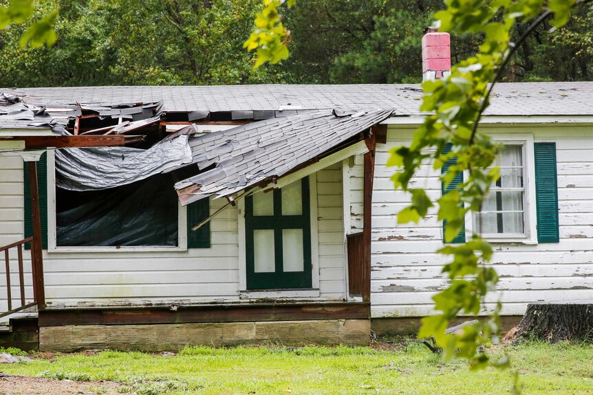 The roof of a house is seen affected by winds from Hurricane Florence.