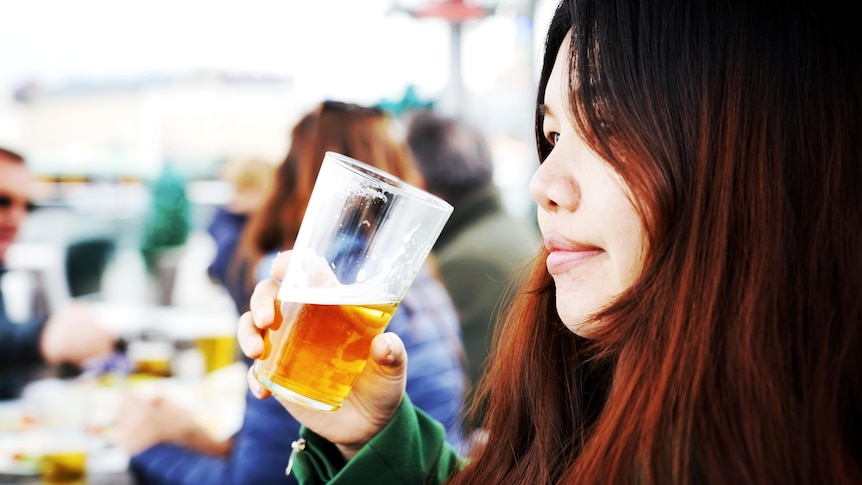 Woman drinking a beer