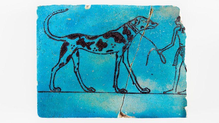 Faience tile with large dog