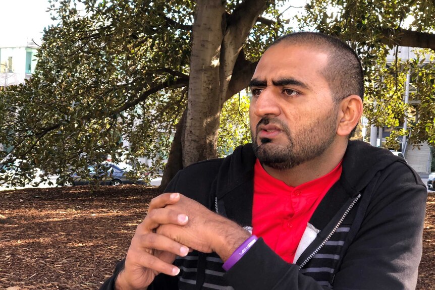 A man sits in a park.