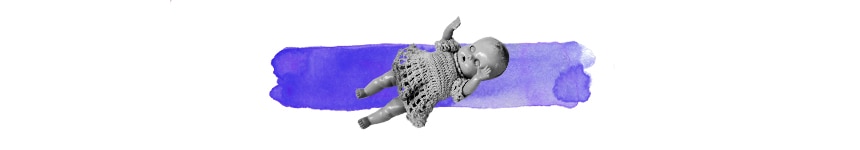 black and white doll on top of a wash of purple colour