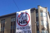 Protesters hung a banner from the Windsor Hotel.