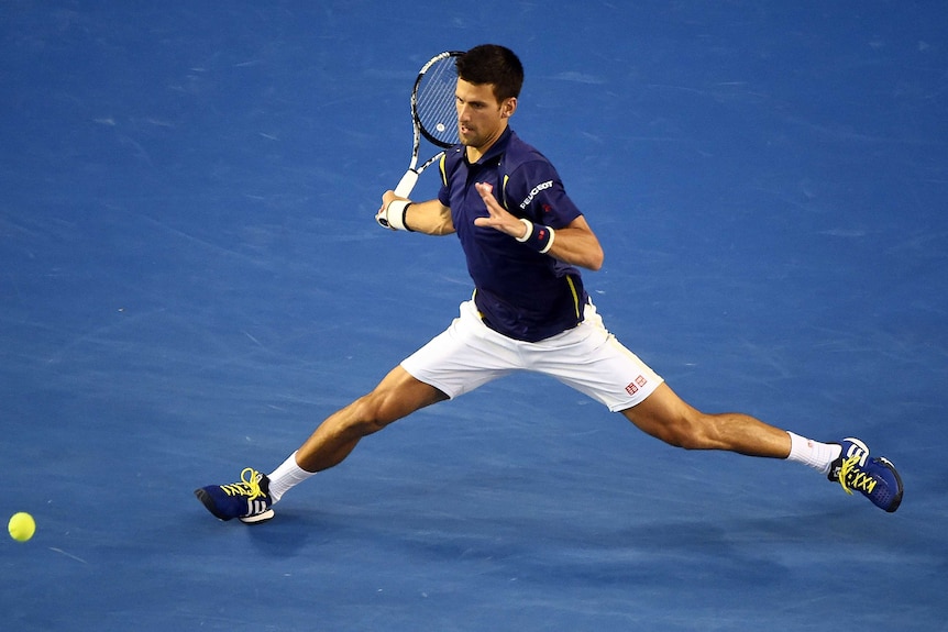 Stunning start ... Novak Djokovic stretches for a forehand in the first set against Roger Federer